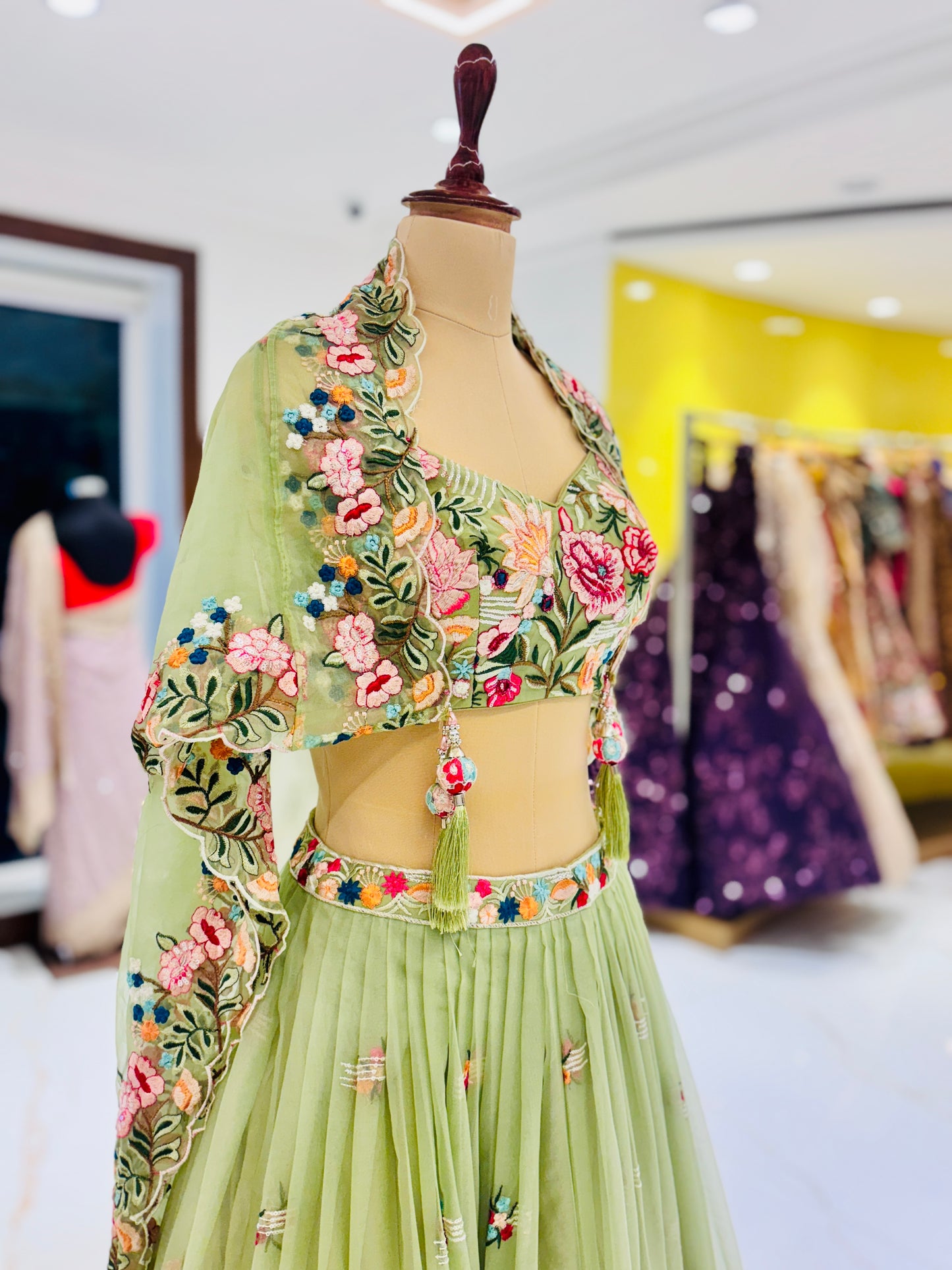 Pastel green lehenga with embroidered blouse and skirt.