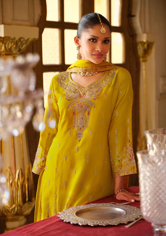 Traditional embroidered salwar kameez with dupatta in mustard colour.