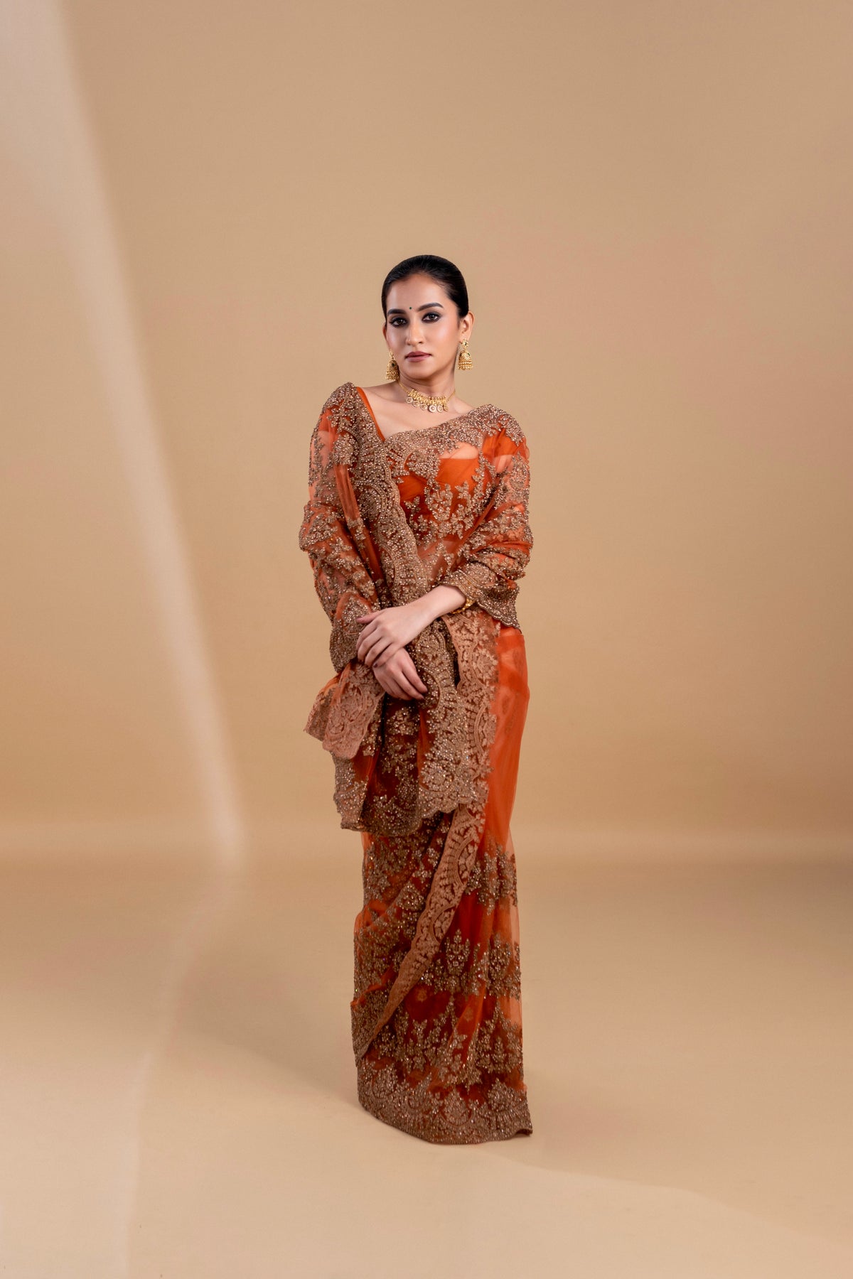 Elegant Rust Orange saree with intricate embroidery