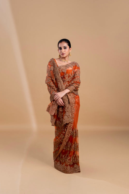 Elegant Rust Orange saree with intricate embroidery