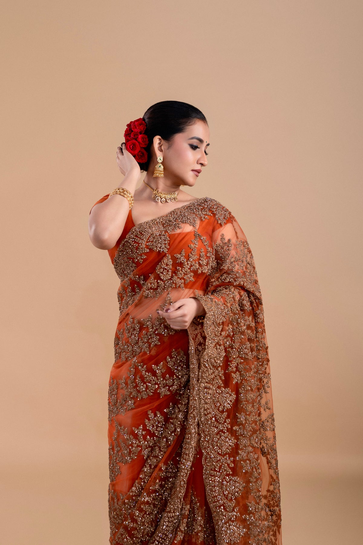 Elegant Rust Orange saree with intricate embroidery