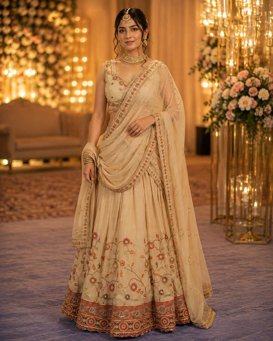 Beautiful ivory lehenga with floral embroidery.