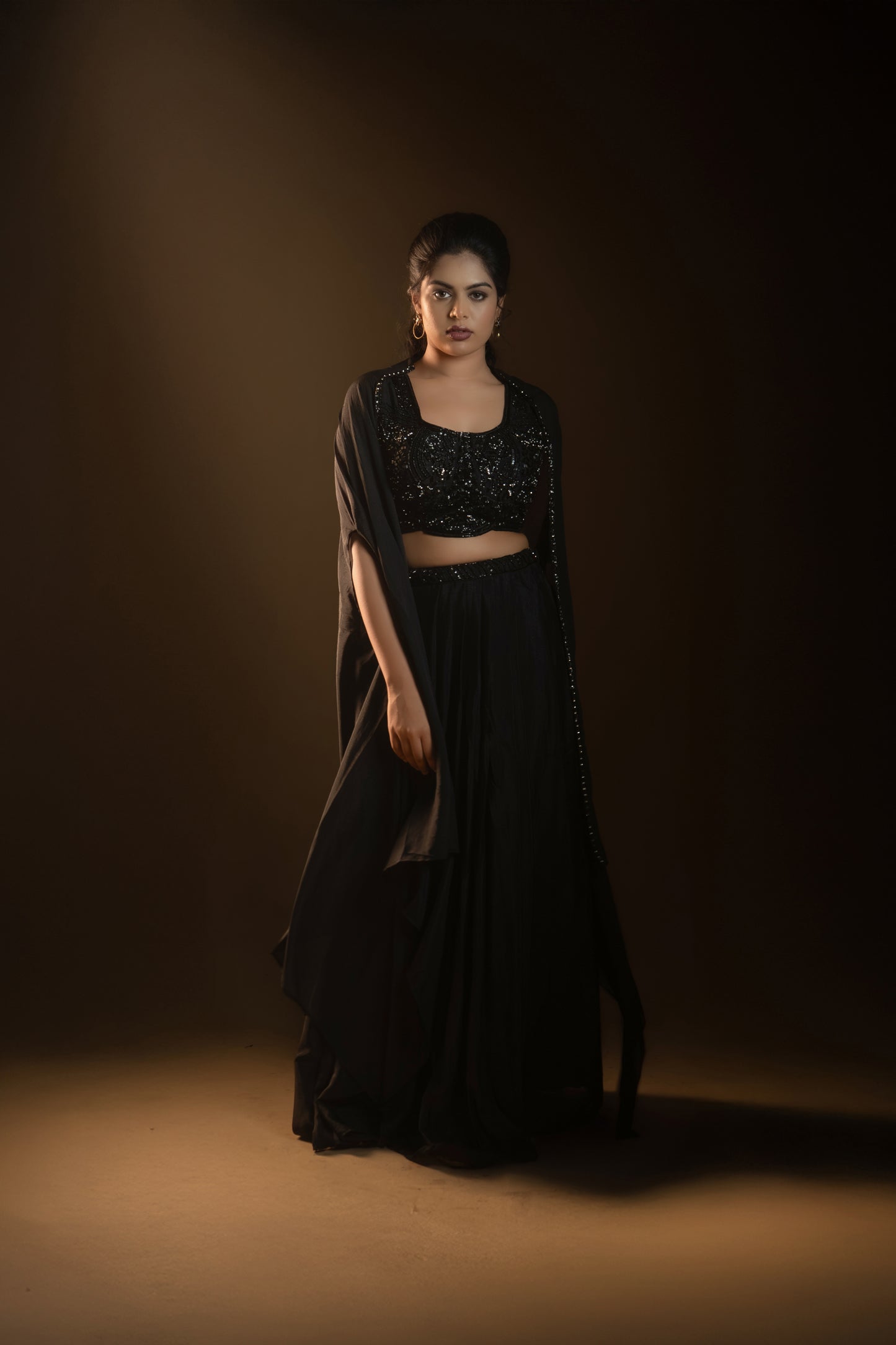 A Stunning black drape skirt lehenga with a jacket