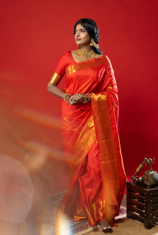 Red silk saree with zari work in the border