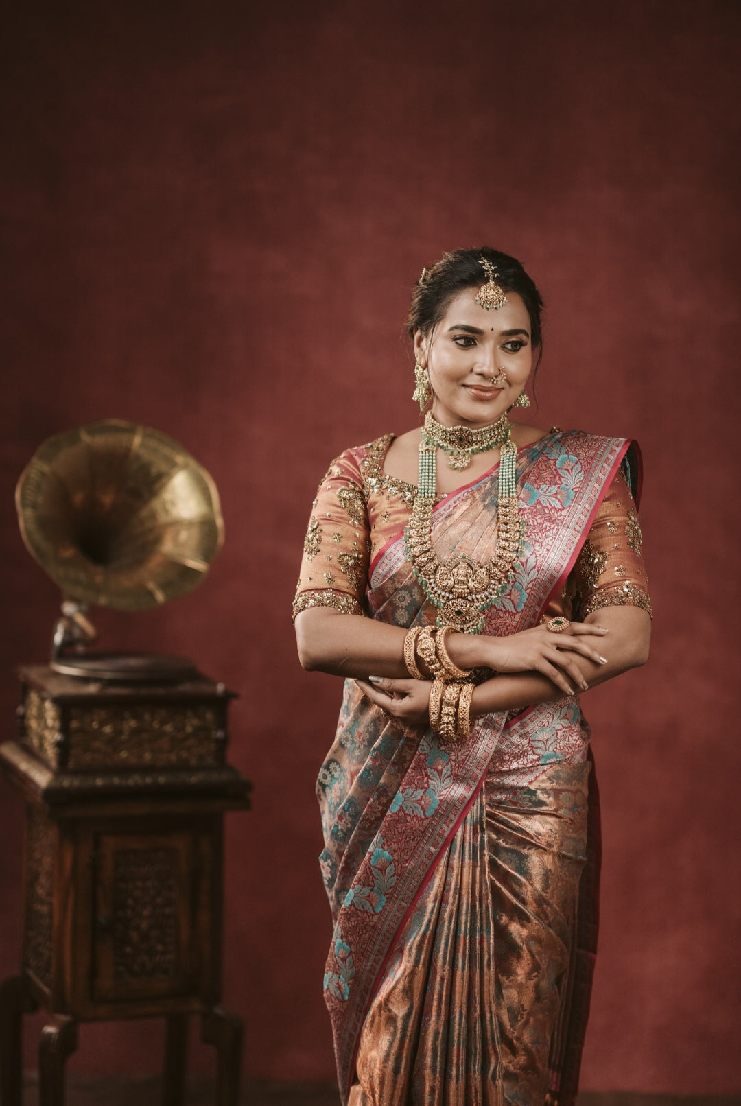 Copper tone silk saree with intricate zari design all over the saree