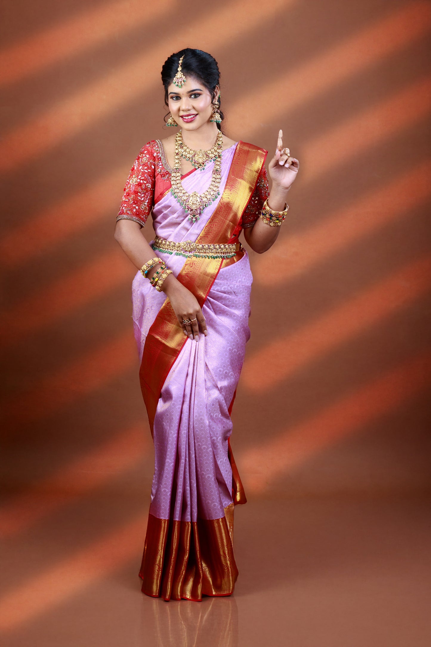 Lavender silk saree with intricate zari and  red colour border