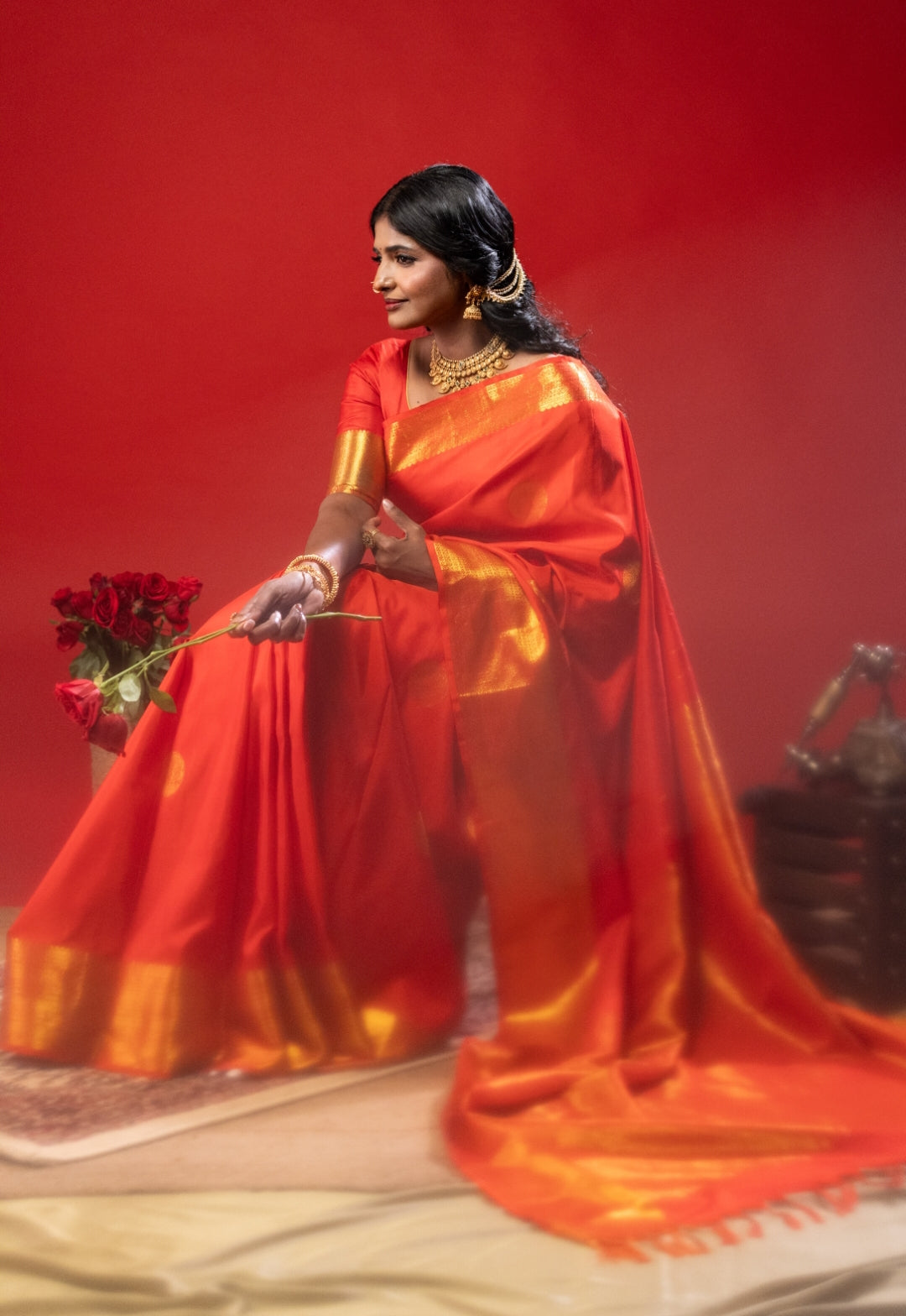 Red silk saree with zari work in the border
