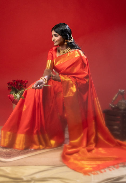 Red silk saree with zari work in the border